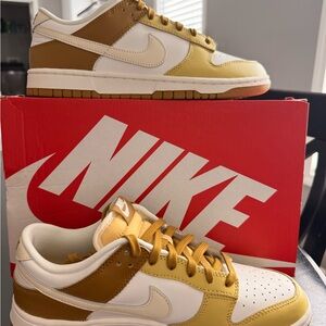 Nike dunk low retro in color bronzine/coconut milk